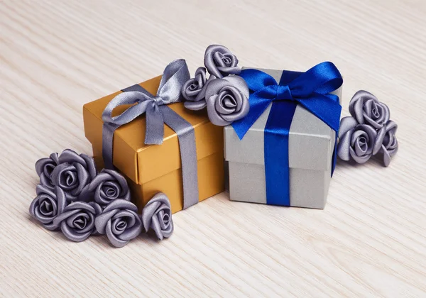 Artificial flowers and two gift boxes — Stock Photo, Image