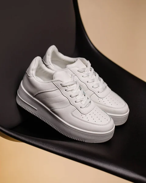 Close Casual Comfortable White Sneakers Black Beige Background Sports Model — Φωτογραφία Αρχείου