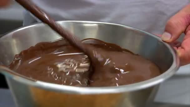 German confectioner stirs chocolate pastry 10776 — Stock Video