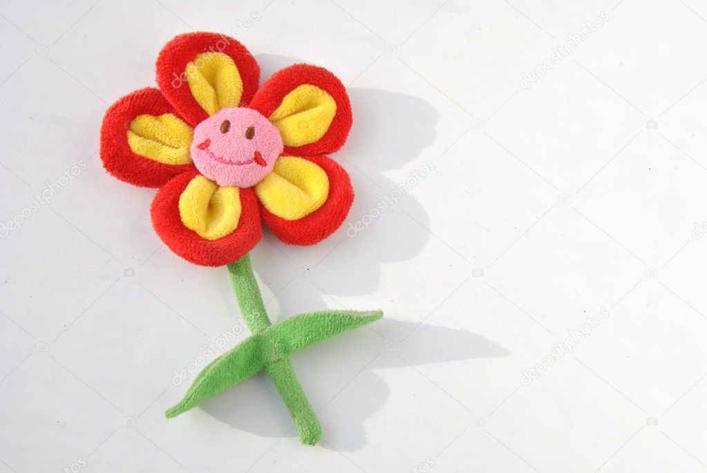 Plush smiling flower with shadow on white background