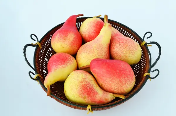 Pears in a winnowing basket — Stock Photo, Image