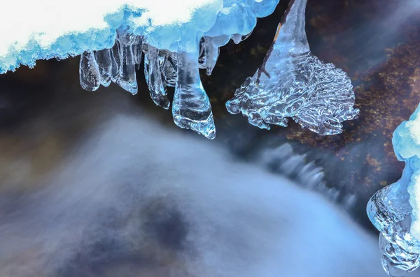 Icicles and milky stream — Stock Photo, Image