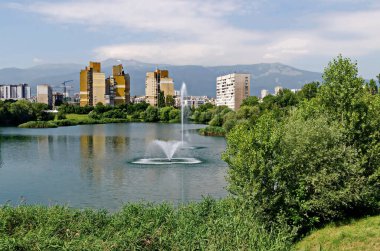 Spring panorama of a part of a residential area with a lake and a fountain,  Drujba, Sofia, Bulgaria 