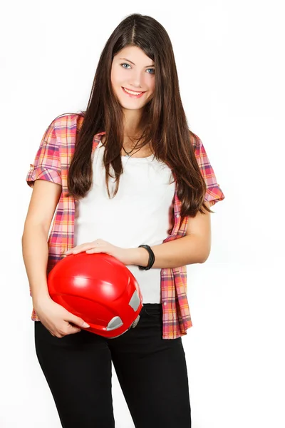 A girl gets on the hip a red building helmet — Stock Photo, Image