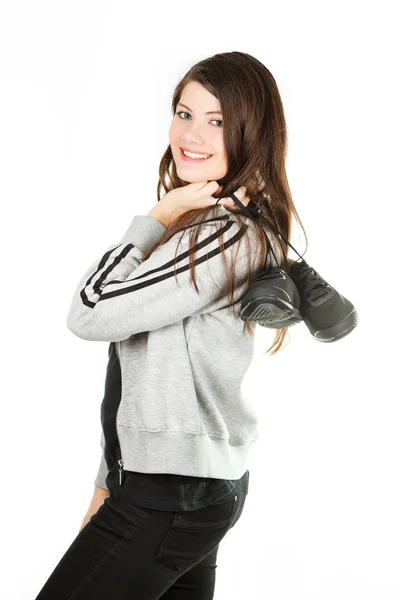 A beautiful girl in a sportwear gets on the hip trainers — Stock Photo, Image