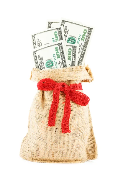 The dollars in a linen sack, bandaged by a gift red ribbon — Stock Photo, Image