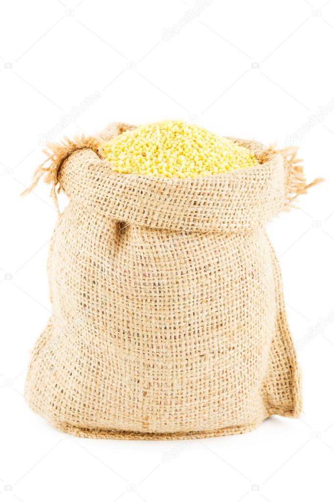 A sack is linen filled by yellow millet