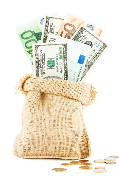 Money dollars and euros in the linen bag and coins scattered near — Stock Photo, Image