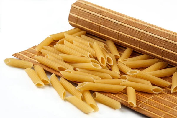 Pasta di grano duro sul tappeto — Foto Stock