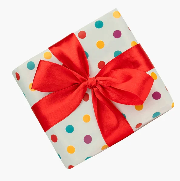 用红丝带包装好的礼品盒参加在白色背景上举行的庆祝活动 图库照片