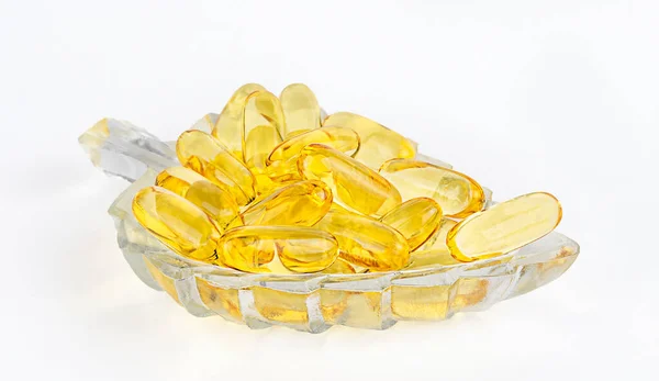 Großaufnahme Von Gold Fischöl Einer Schüssel Auf Weißem Hintergrund Nahrungsergänzungsmittel — Stockfoto