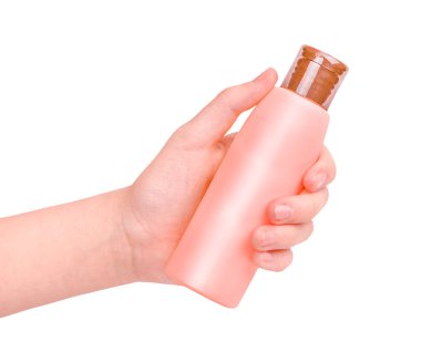 Beyaz arkaplanda izole edilmiş güneş kremi tutan bir el kremi