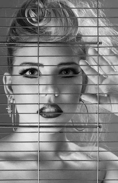 Fashion beautiful woman inside jail cell — Stock Photo, Image