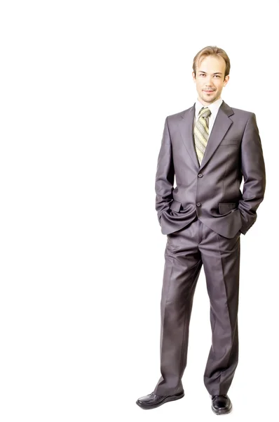 Young businessman keeps hands in pockets — Stock Photo, Image