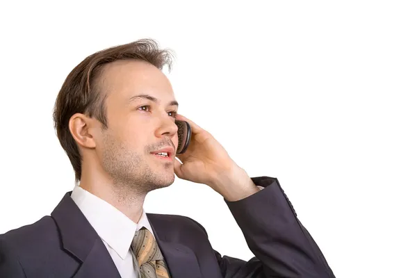Un uomo d'affari sorridente parla al telefono — Foto Stock