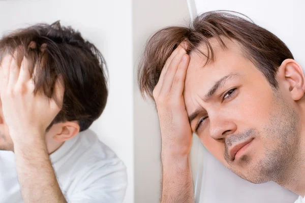 Sleepy man suffers from hangover — Stock Photo, Image