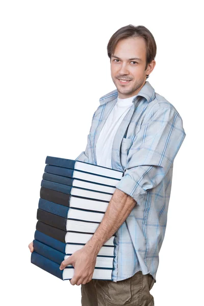 The portrait of smiling young man holding stack of books — Stock Photo, Image