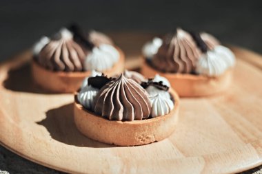 Homemade mini tart with chocolate and whipped cream