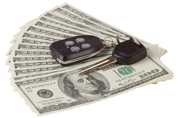 Bizi dolar ve araba anahtarı ve beyaz arka plan üzerinde izole alarm — Stok fotoğraf