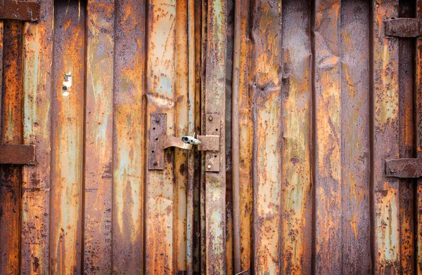 Old padlock on rusty garage collars — Stock Photo, Image