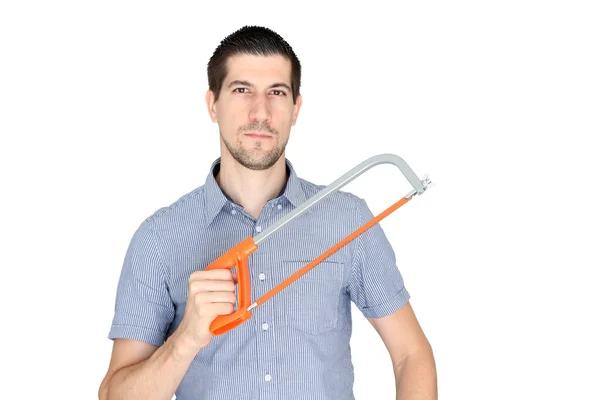 A portrait of casual young man holding a tool — Stock Photo, Image