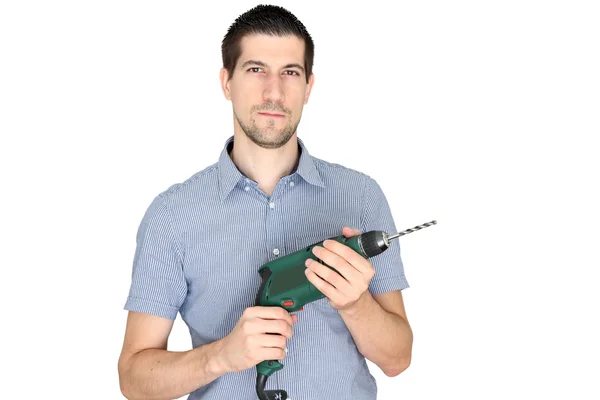 A portrait of casual young man holding a tool — Stock Photo, Image
