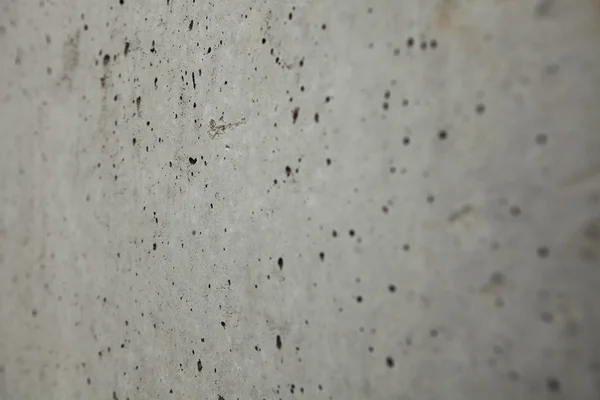 Strukturen i grå betong vägg - selektiv fokus bakifrån. — Stockfoto