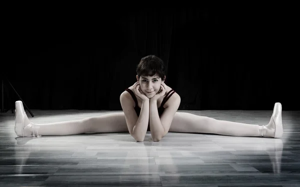 Teen girl ballerina doing split