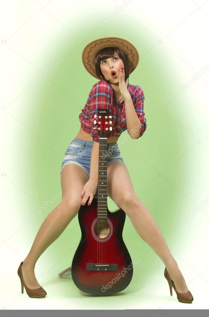Country style  pIn- up girl  with a guitar
