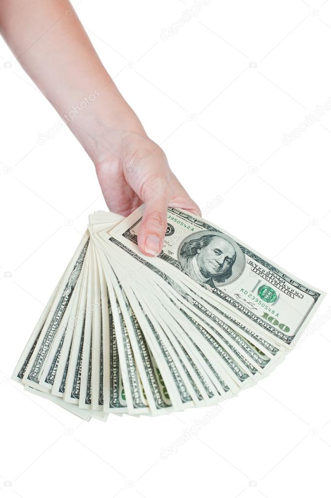 Stack of hundred dollar bills in hand