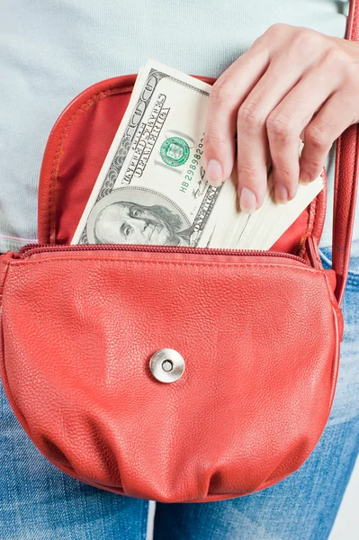 Pack of hundred dollar bills in a handbag — Stock Photo, Image
