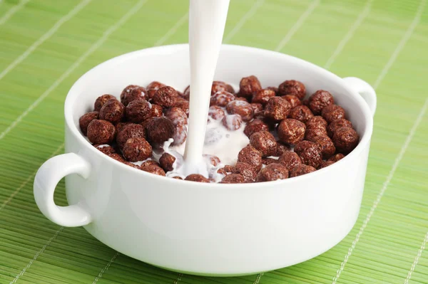 Breakfast cereals, chocolate balls with milk — Stock Photo, Image