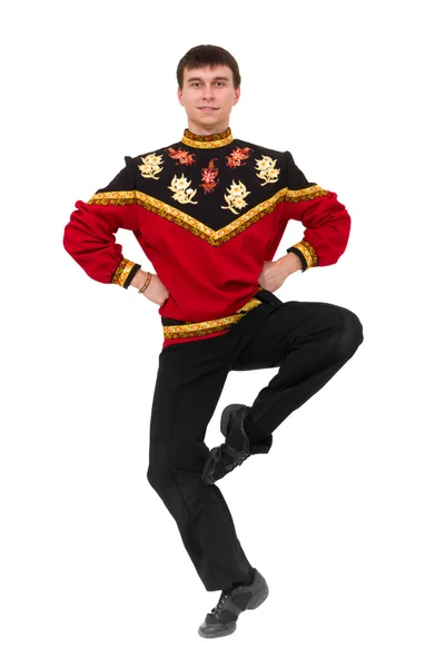 Hombre atractivo vistiendo un disfraz popular ruso bailando —  Fotos de Stock
