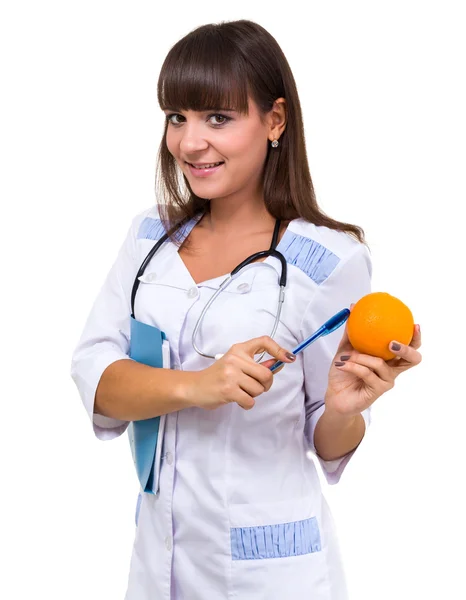 Médico sonriente con naranja —  Fotos de Stock