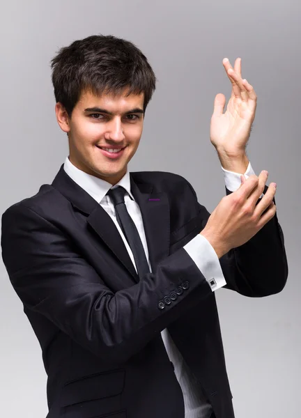 Man adjusts his cufflinks — Stock Photo, Image