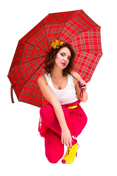 Junge Frau mit rotem Regenschirm — Stockfoto