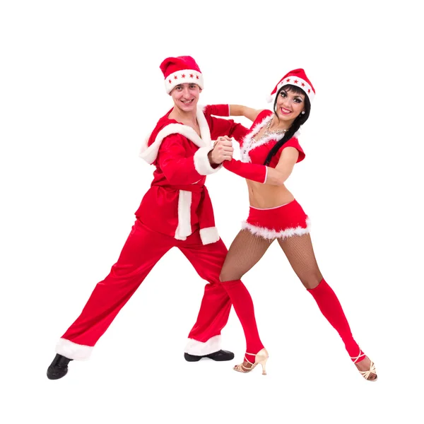 Happy young couple wearing santa claus clothes — Stock Photo, Image