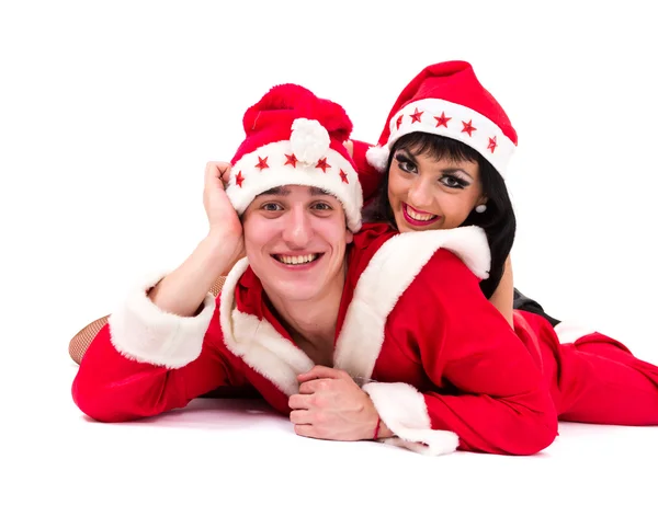 Happy young couple wearing santa claus clothes — Stock Photo, Image