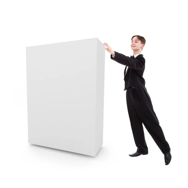 Homem vestido com um casaco empurra uma caixa em branco — Fotografia de Stock