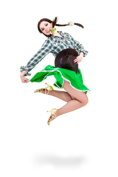 Smiling cowgirl jumping — Stock Photo, Image