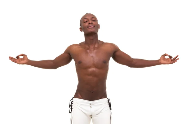 Young muscular man meditating — Stock Photo, Image