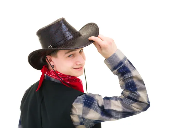 Cowboy holding his hand on his hat — Stock Photo, Image