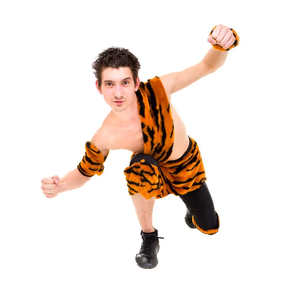 Wild man wearing a tiger skin posing — Stock Photo, Image