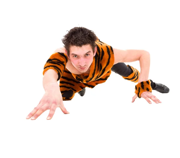Wild man wearing a tiger skin crawls — Stock Photo, Image