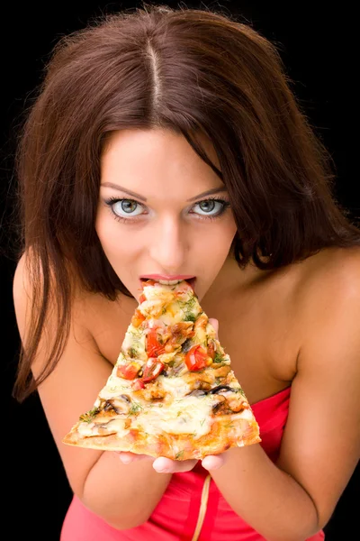 Junge Frau isst ein Stück Pizza Stockfoto