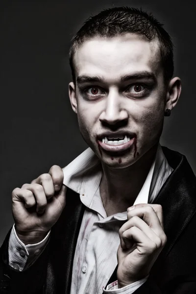 Dark dramatic portrait of a young vampire — Stock Photo, Image