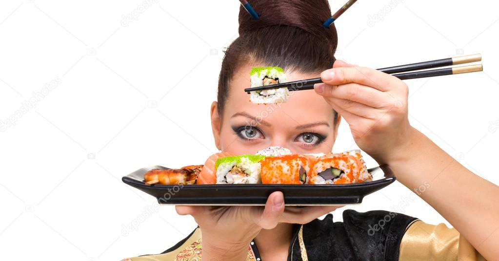 Close up portrait of young woman with sushi