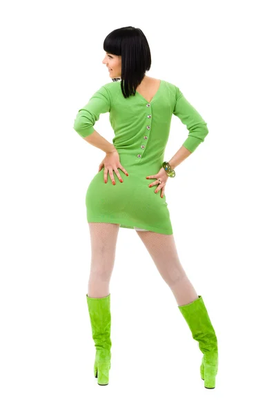 Mujer sonriente con un vestido verde y zapatos verdes en un aislado — Foto de Stock