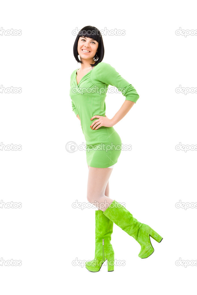 緑のドレスと緑の靴を着ている女性の笑みを浮かべてください ストック写真 C Stepstock