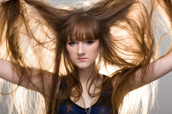 Woman shows her beautiful hair — Stock Photo, Image